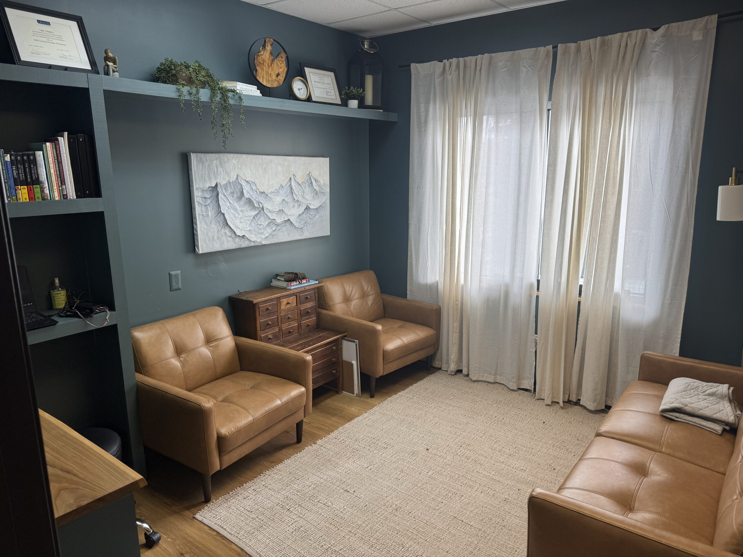 photo of counseling room with two chairs and couch