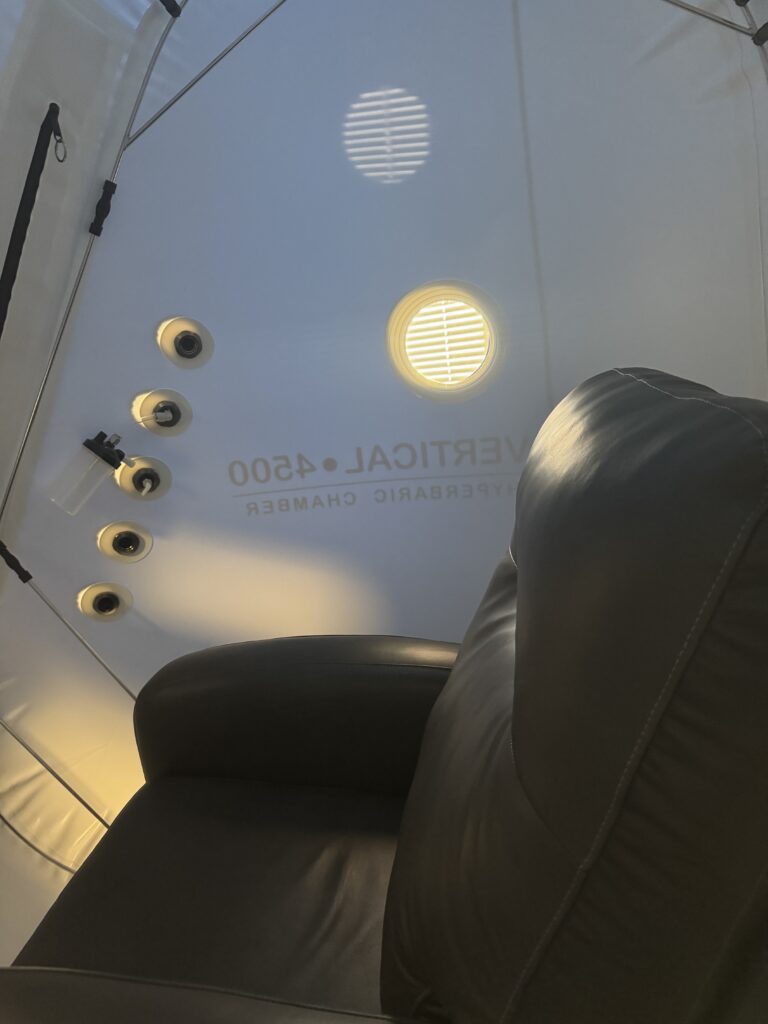 photo of inside hyperbaric chamber with recliner