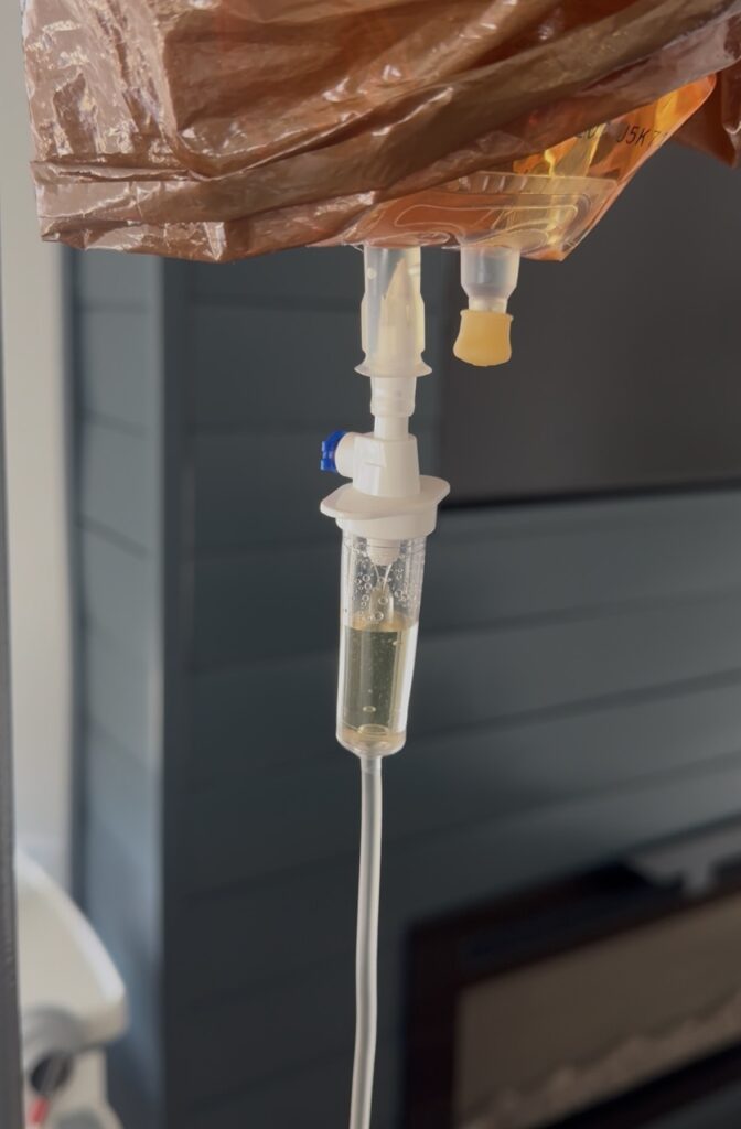 IV fluid dripping into tubing