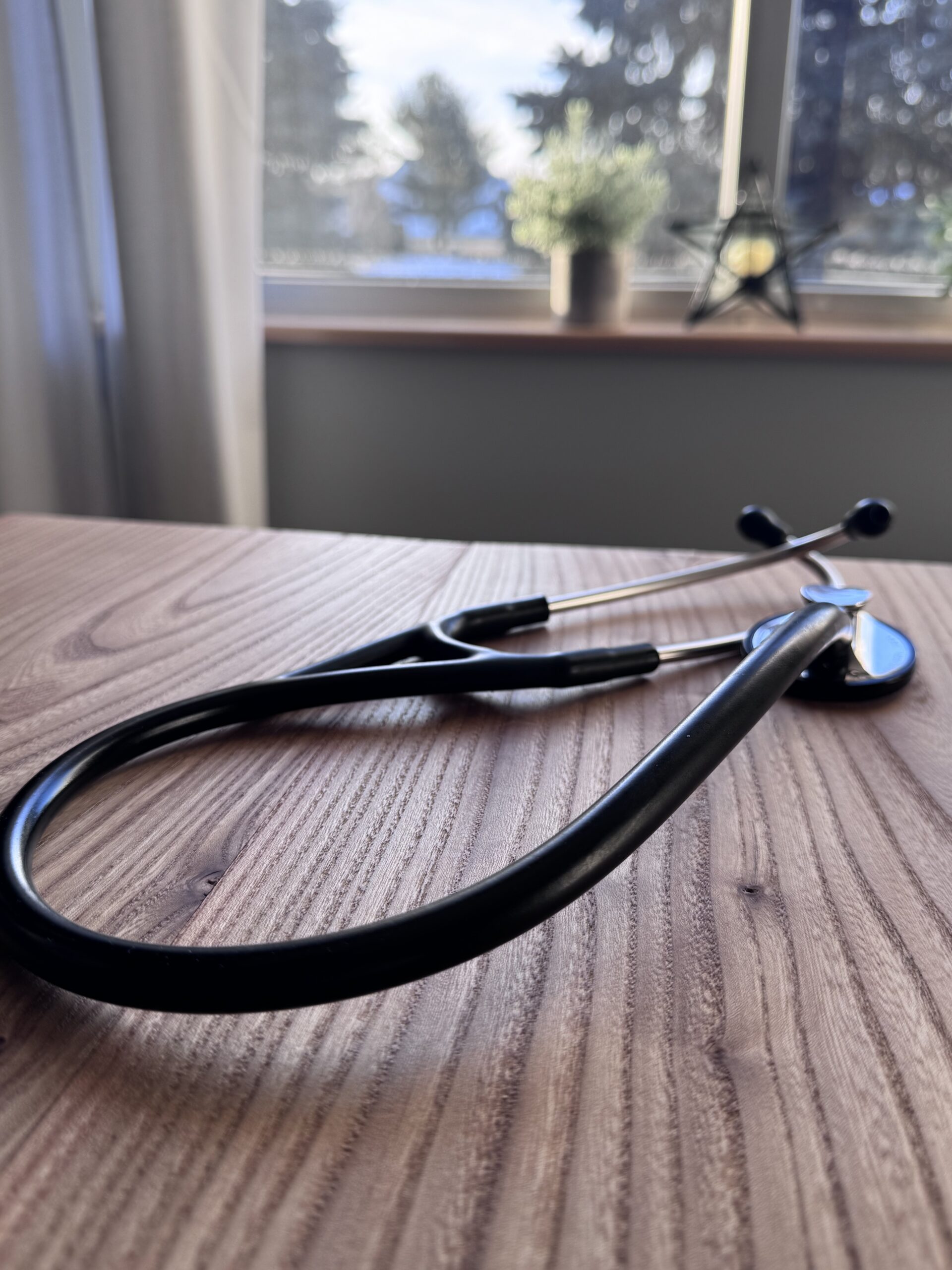 close up of stethoscope in front of window