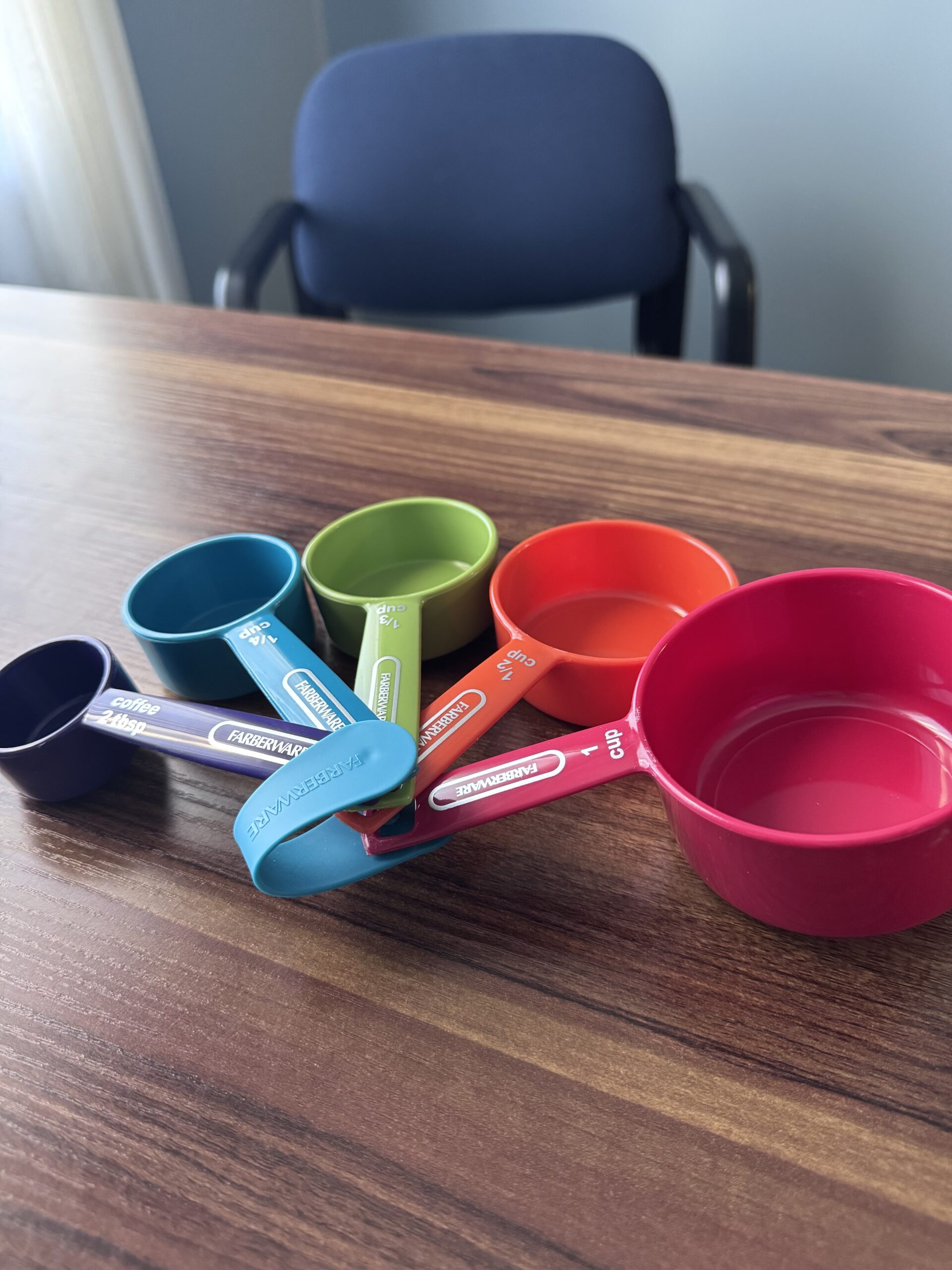 measuring cups spread out on desk
