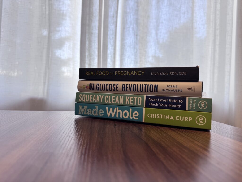photo of nutrition books on desk in front of window