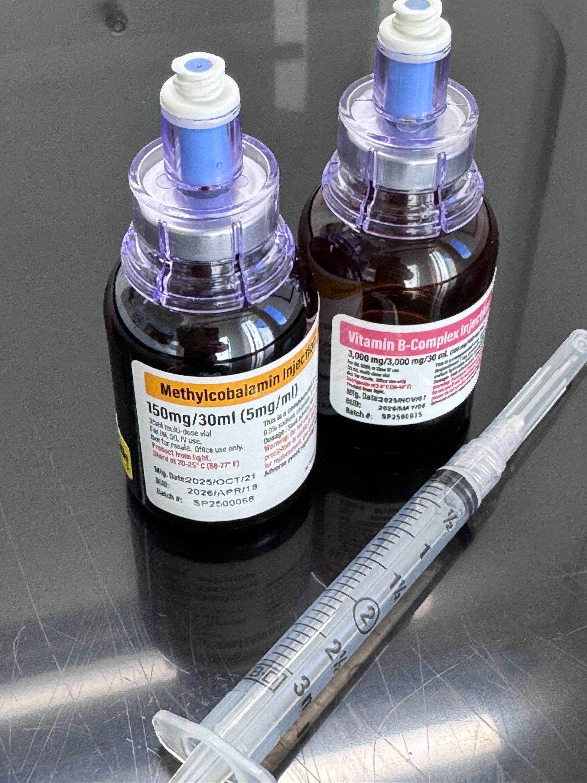 photo of iv nutrients in bottle with syringe